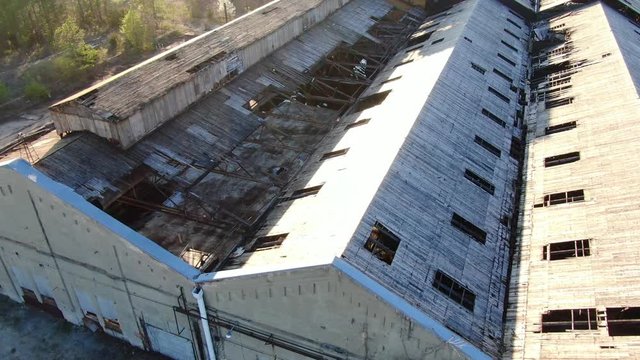 Rising Aerial Shot of an Abandoned Factory Roof