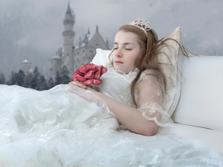 Photo montage with sleeping beauty sleeping in bed with a castle in the background