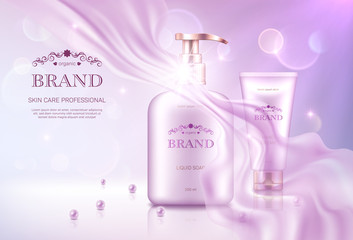 Liquid soap dispenser and hand cream tube with golden lids on pink bokeh background with transparent chiffon fabric. Advertising poster for the promotion of cosmetic skin care premium product