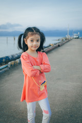 happy little girl pose on the jetty