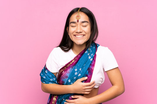 Young Indian Woman With Sari Over Isolated Background Smiling A Lot