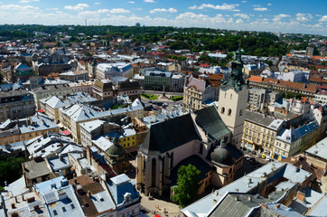 Obraz premium Panorama of the city of Lviv. Medieval city with red tiled roofs. A city for romantic people and lovers. Cozy Europe. Lviv, Western Ukraine, July 18, 2017