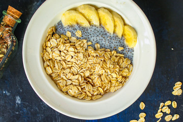 healthy food smoothie bowl, oatmeal, chia seeds and berries (breakfast dish or healthy snack) menu concept. background. top view. copy space