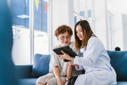Young doctor consulting senior patient at health care clinic 