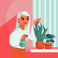 Young woman looking after plants at home