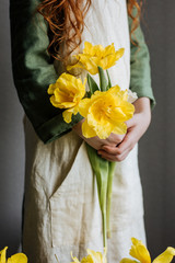 Yellow tulips in an apron pocket
