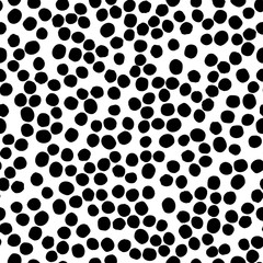 Seamless polka dot pattern hand drawn with a brush. Vector Monochrome Grunge texture of circles. Scandinavian background
