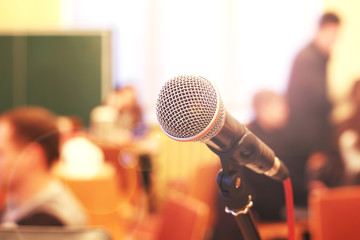 Close up microphone on the background of the hall