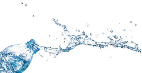 isolated of water splashing form the bottle on white background.
