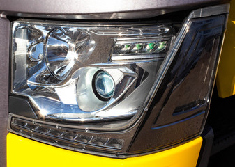 Modern truck headlight with diode illumination. Road safety concept, close-up. LED