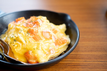 Creamy omelet with crab stick cover rice