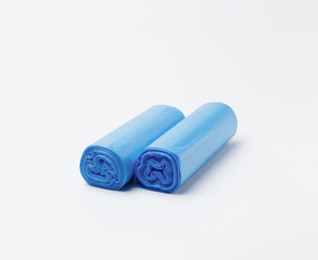 Disposable plastic bags for household garbage or waste on a white background