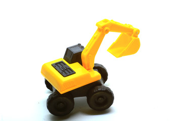Fototapeta na wymiar photos of miniature excavators as a tool for introducing development tools to children at school