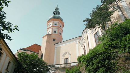 Mikulov Castle Tower with Dome from Green Courtyard with Trees on Rock on Sunny Summer Day, Czech Republic, Europe.