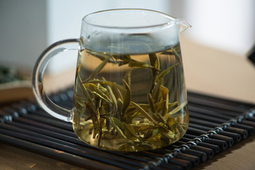 Tea break time, a cup of freshly brewed black tea, escape from steam, warm and soft light