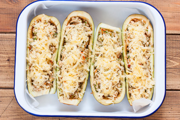 Step-by-step preparation of stuffed eggplants, step 4 - filling the filling of raw eggplant in a baking dish, top view, horizontal