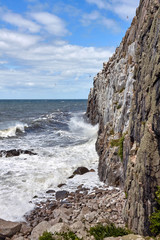 Waves beating against the cliff by the Jons Kapel (John's Chapel), Bornholn island, Denmark.