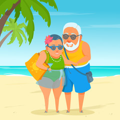 An active happy elderly tourist couple standing on beach sand. Summer sunny day at the resort. Cute funny grandma and grandpa. A cartoon senior adult in swimwear. Sea on the background.