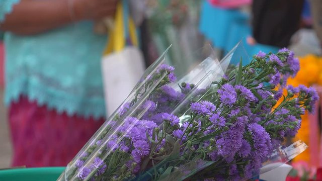 A bouquet of flowers in market for sale to gife of congraturation education to students