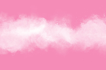 White powder explosion on pink background. Paint Holi.