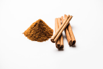 Powder cinnamon and sticks also known as Dalchini or Dalcheenee masala from India, selective focus