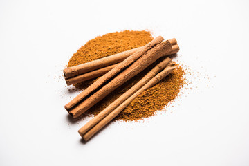 Powder cinnamon and sticks also known as Dalchini or Dalcheenee masala from India, selective focus