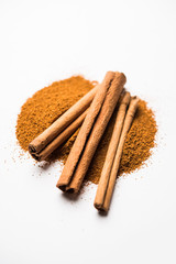 Powder cinnamon and sticks also known as Dalchini or Dalcheenee masala from India, selective focus
