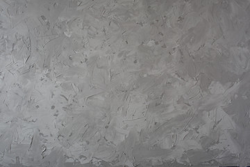 Textural gray background made under concrete. Made of putty mixed black and white