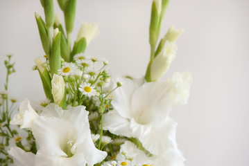 Bouquet of white flowers. Whiteness delicate gladiolus. Close-up, white background