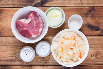 Step-by-step preparation of sauerkraut stew with meat, step 1 - preparation of the necessary ingredients, top view, horizontal