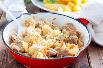 Braised sauerkraut in a pan, selective focus