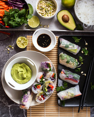 Summer rolls with vegetables, rice noodles and avocado dip, vegan food - 329094676