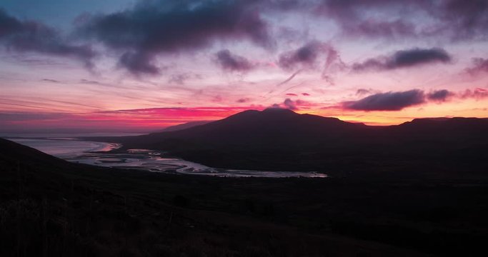 Breathatking and spectacular 4K Time lapse video of sunrise in Brandon mountains, with moving slouds, shadows and sun rays, Dingle Peninsula, Ireland
