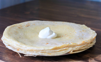 pancakes on a plate with sour cream
