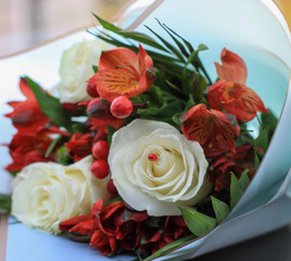 bouquet of flowers with white roses, barberry and Alstroemeria