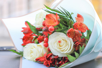 bouquet of flowers with white roses, barberry and Alstroemeria