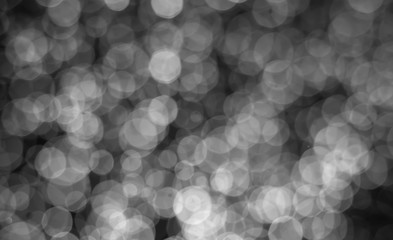 abstract white subtle bokeh bright on dark bacground for holiday , blurred image