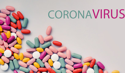 Stack of different pills isolated on grey background. Coronavirus - 2019-nCoV