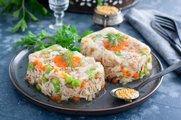 Homemade jelly with chicken, pork peas with slices of carrots, horizontal