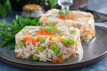 Homemade jelly with chicken, pork peas with slices of carrots, horizontal