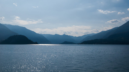 panoramic view of Lake Como, mountains and blue sky from tower of Castello di Vezio, Varenna, Como lake, Lombardy, Italy