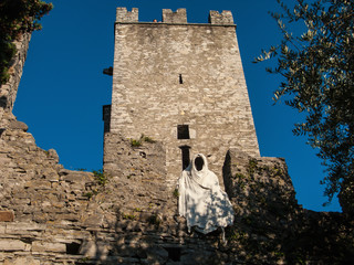 the tower and ghosts of Castello di Vezio, Varenna, Como lake, Lombardy, Italy