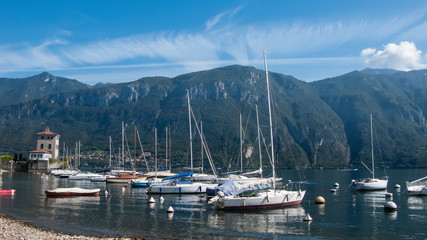 Fototapeta na wymiar blue sky, white clouds, mountains, yachts, lake Сomo, Bellagio, Italy