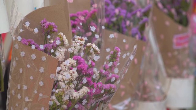 A bouquet of flowers in market for sale to gife of congraturation education to students