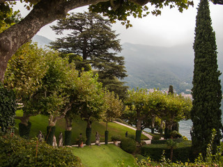 beautiful views, green lawns, trees, bushes and sculptures of the Villa Balbianello, Lenno, lake Сomo, Tremezzina, Italy