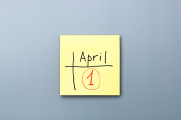 april fools day reminder on yellow sticky note. be aware and do not let be fooled