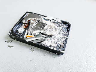 Shattered platter of computer hard drive disk.