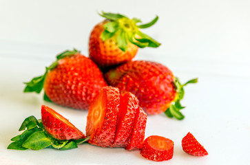 Several strawberries surrounded by white background