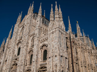 Duomo di Milano on background of blue sky at sunny day, Milan, Lombardy, Italy