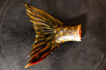fish tail in the pan. pike tail. a fish dish